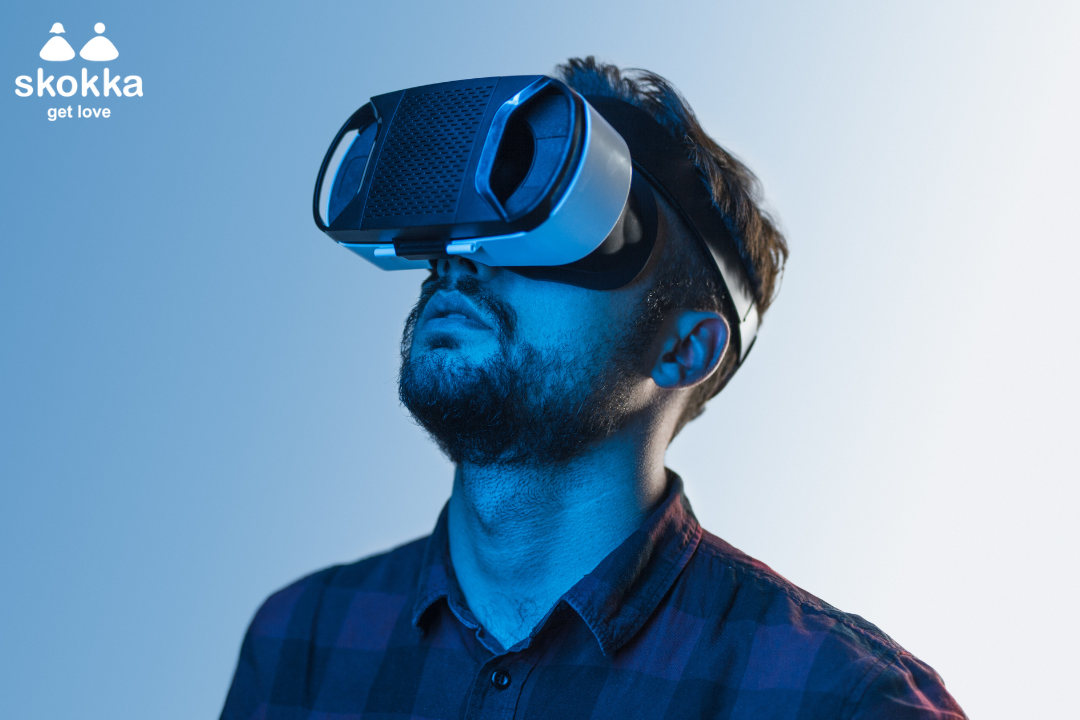 A man with a VR headset on, watching porn.